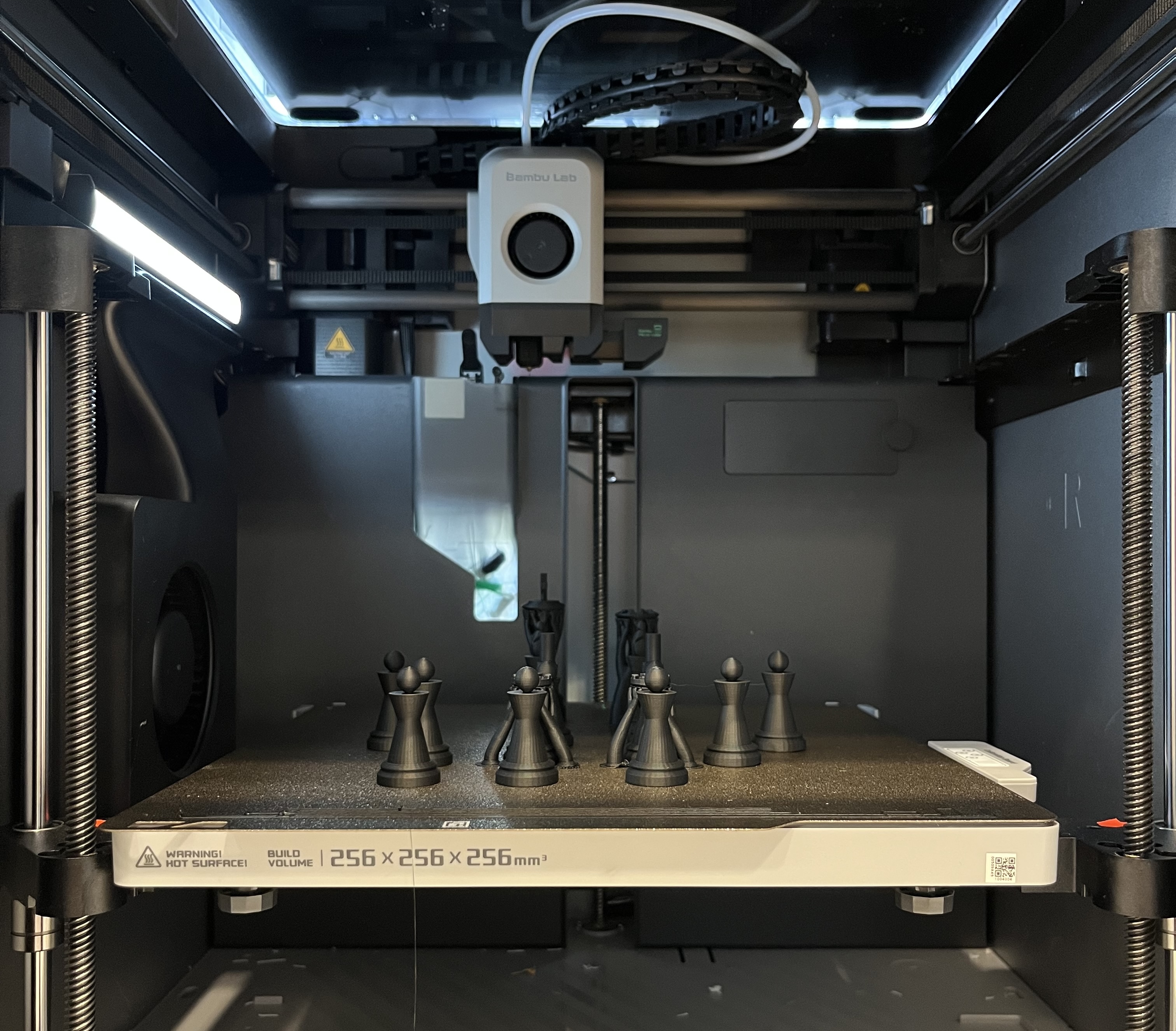 Chess pieces being 3D printed for the chess robot project
